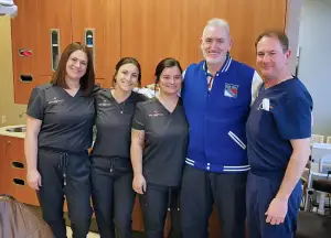 Dr. Dickson and the team with an implant patient