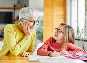 grandparent teaching granddaughter